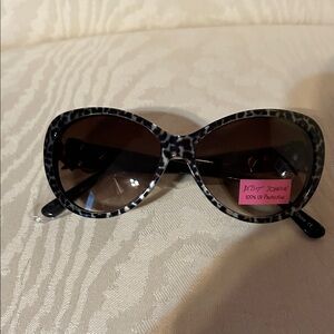Betsey Johnson Black and Gray Animal Print Sunglasses. They are brand new .